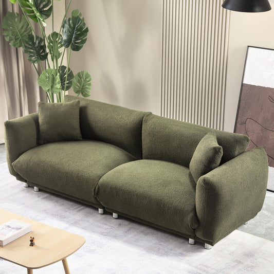 A lovable, fat, bread-like sofa with 2 pillows and metal feet with anti-skid pads